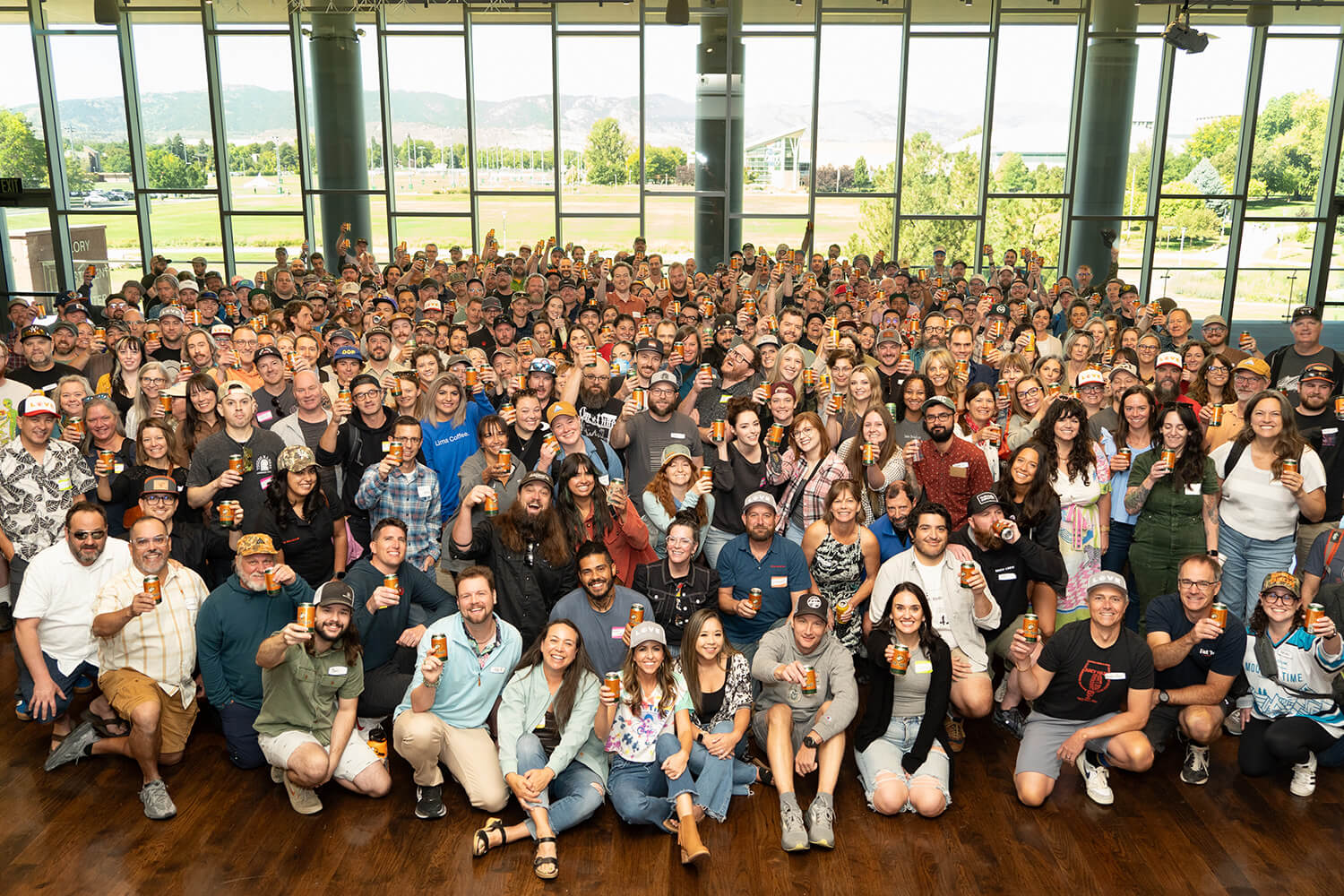 Coworkers pose for a group photo after the 2024 State of the Business meeting in Fort Collins, CO